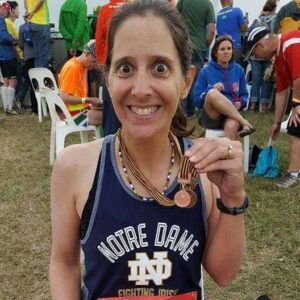 comrades marathon finisher with back to back medal